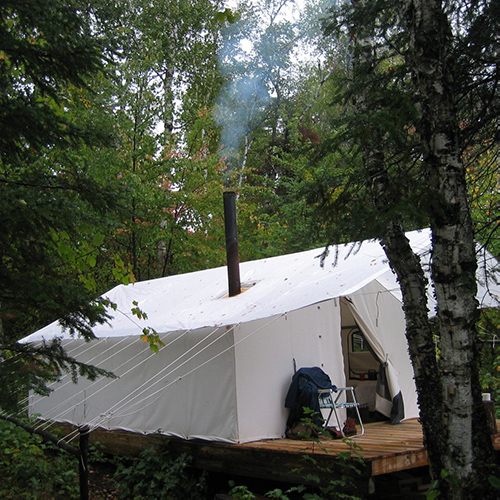 Canvas Military tents with wood stove glam camp