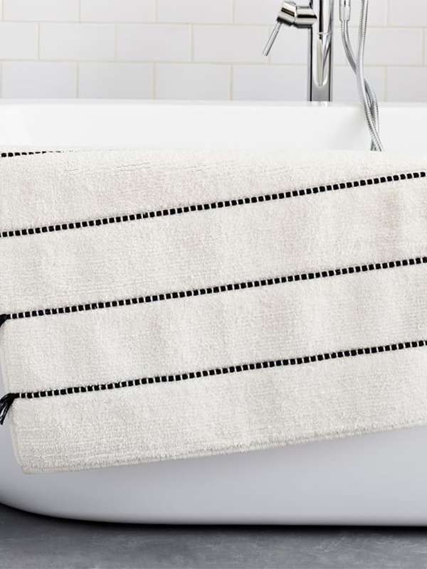Organic fringe striped bath mat