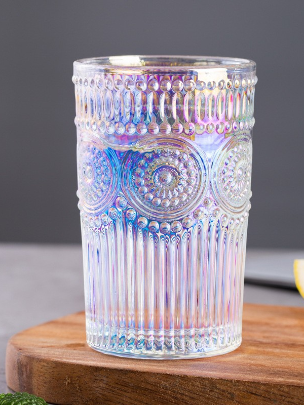 Embossed gold-rimmed glass cup