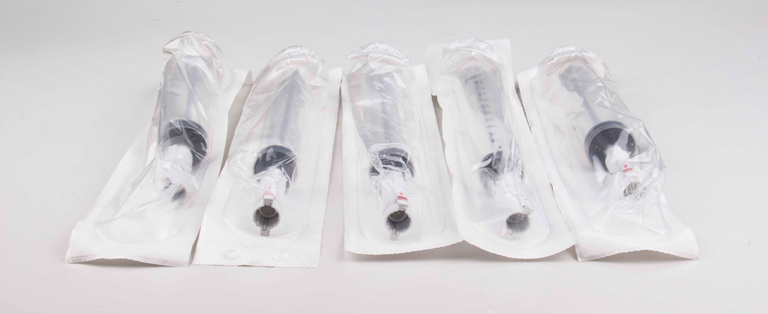 Flexible package material for syringe