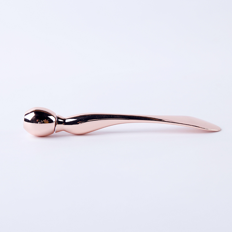 curved cosmetic spatula