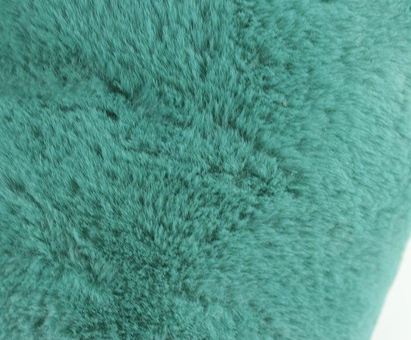Chevron shaped rabbit fur faux fur cushion in green short plush 1