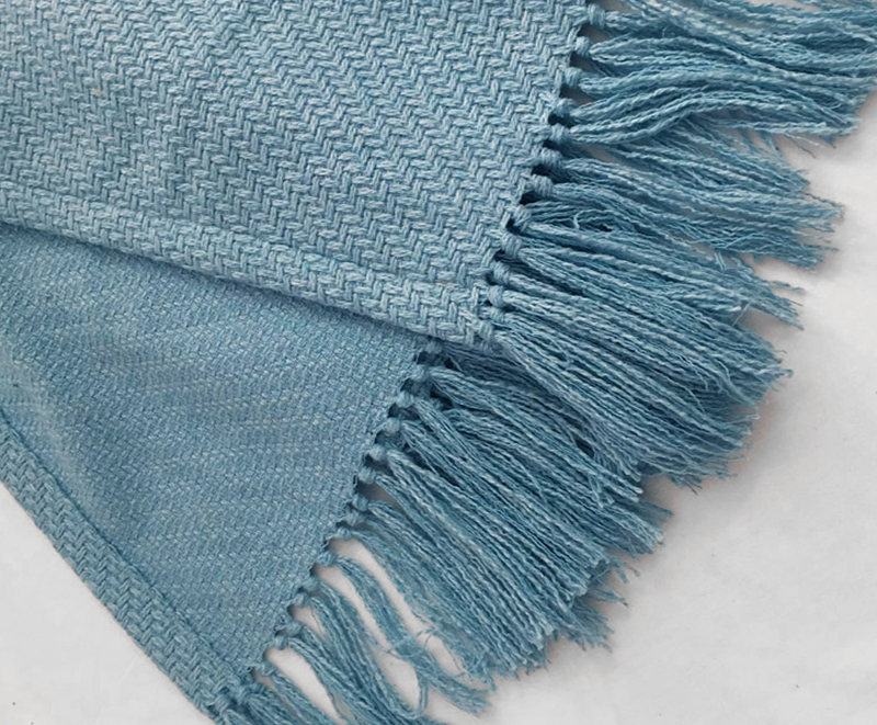 Soft and cozy blue fringed knitted blanket 1