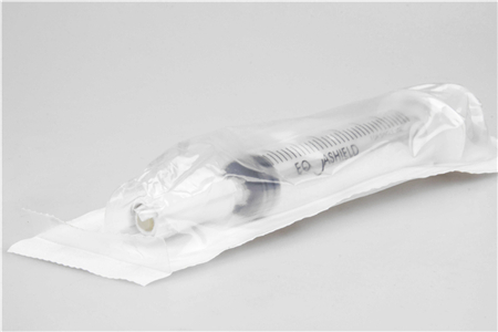 Flexible package material for syringe