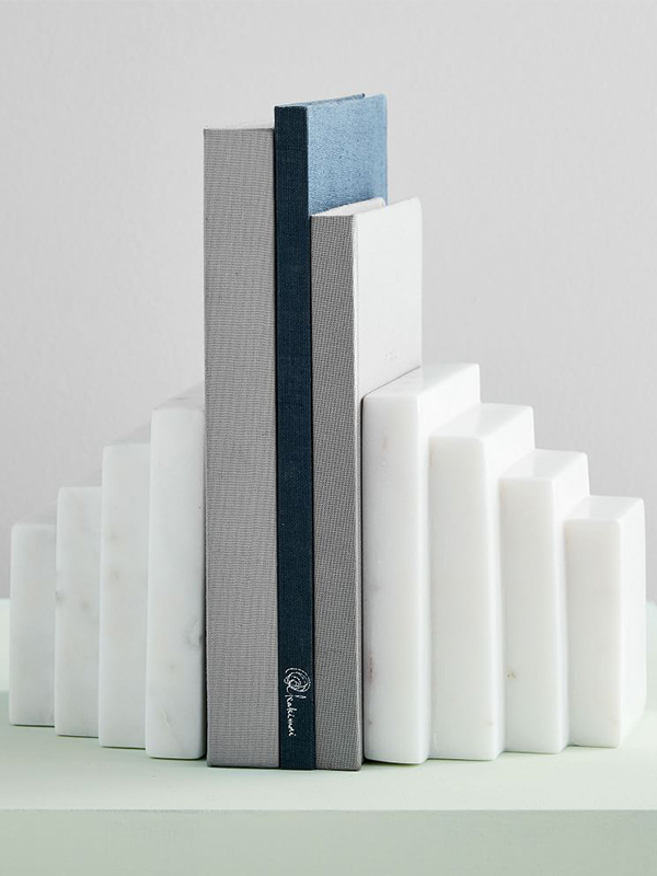 Stepped white marble bookends